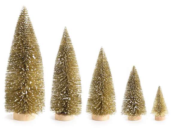Set of 5 snow-covered gold glitter Christmas trees on wooden