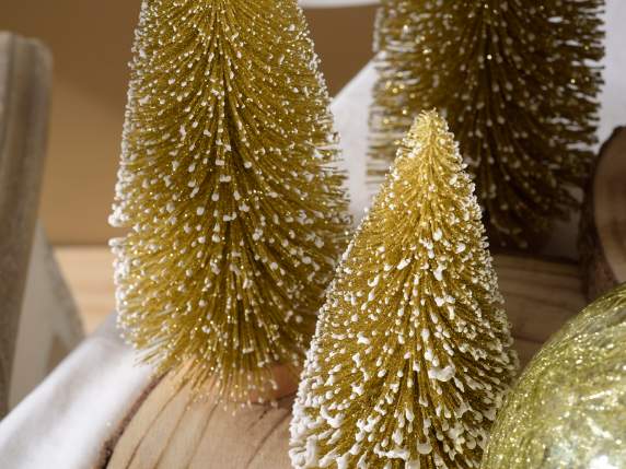 Set of 5 snow-covered gold glitter Christmas trees on wooden
