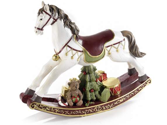 Rocking horse in colored resin with Christmas decorations