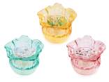 Bougie parfumée dans un pot en verre avec une fleur colorée