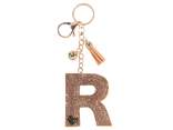 Charm / breloc litera R bronz cu strasuri si ciucuri