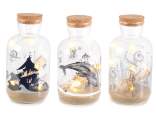 Glass jar with parchment, sand and LED light