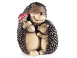 Hedgehogs in a tender embrace in colored magnesia
