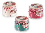Scented candle in glass jar with Christmas decorations