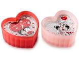 Scented candle in the shape of a heart in glass with lovers