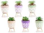 Vase en ciment décoré de plante artificielle et trépied en b