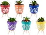 Vaso cemento decorato con pianta artificiale e treppiede