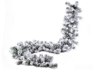 Artificial snow covered fir garlands