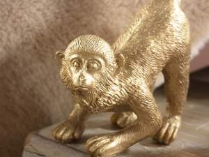 Grossisti scimmia resina oro
