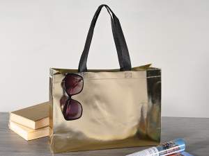 Wholesaler non woven fabric bags gold