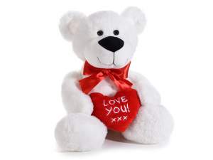 Plush bear with stuffed heart 