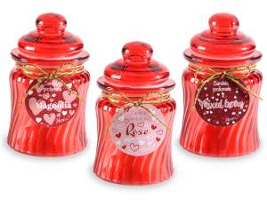 Scented candle in colored glass jar with cap