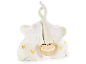 Pair of porcelain elephants w / led light and golden heart