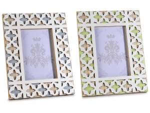 Wooden photo frame with colored carvings to rest