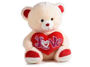 Sitting teddy bear with heart and 