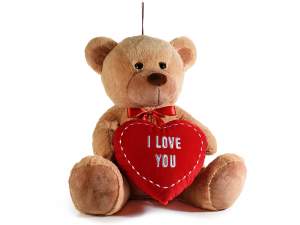 Teddy bear with stuffed heart and red bow