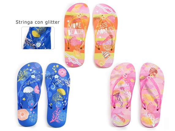 A pair of women's flip flops with glitter string At the bott