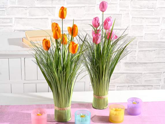 Planta ornamental artificial con tulipanes para apoyar
