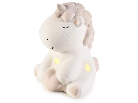 Unicornio sentado en porcelana mate con luz LED