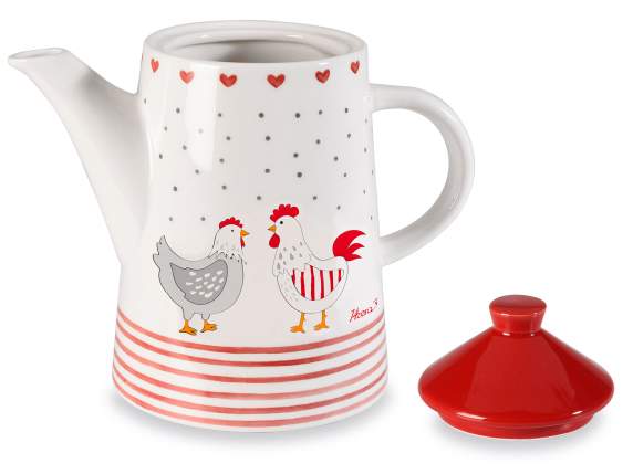 Tetera de cerámica con tapa y adornos de pollo y corazón.