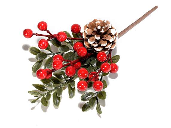 Artificial bouquet with snow-covered pine cone and red berri