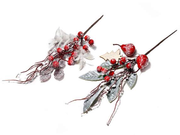Artificial snow-covered sprig with berries and red fruits