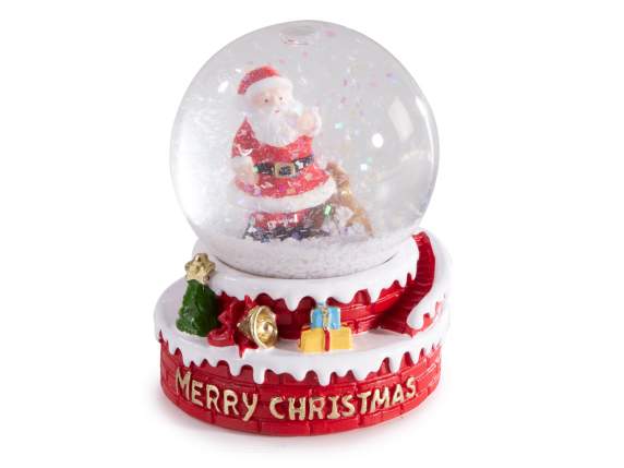 Bola de nieve con motivos navideños sobre base de resina