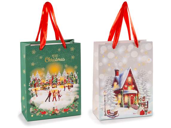 Bolsa-sobre de papel mediano con asas y decoración navideña.