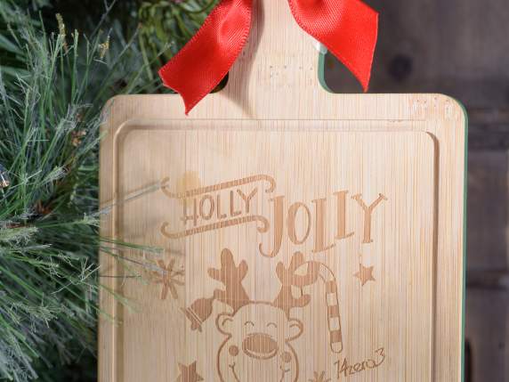 Wooden cutting board with Christmas decorations on display o