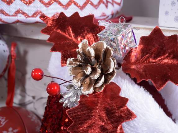 Sprig with snow-covered pine cone and decorations