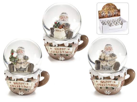 Christmas snow globe in resin-based coffee cup on display