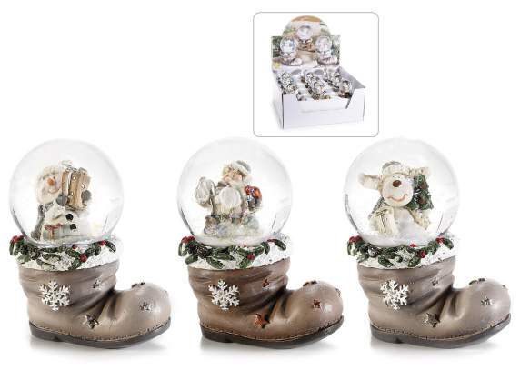 Christmas snowball on resin boot on display
