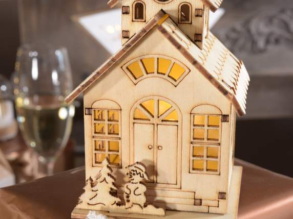 Laser-worked wooden Christmas house with LED light