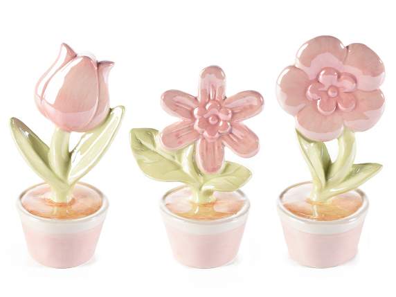 Decorative flowers in pearly glossy ceramic to be placed on