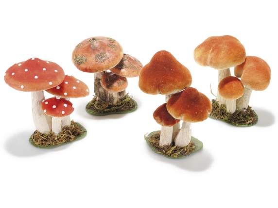 Trio of mushrooms covered in paper and fabric
