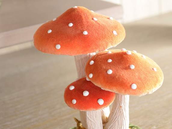 Trio of mushrooms covered in paper and fabric