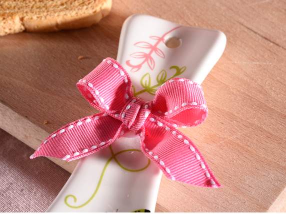 Glossy ceramic spoon rest with bunnies and bow