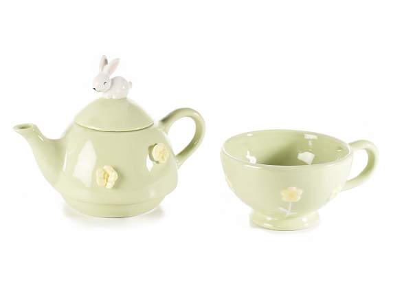 Ceramic teapot and cup with flower and rabbit decorations
