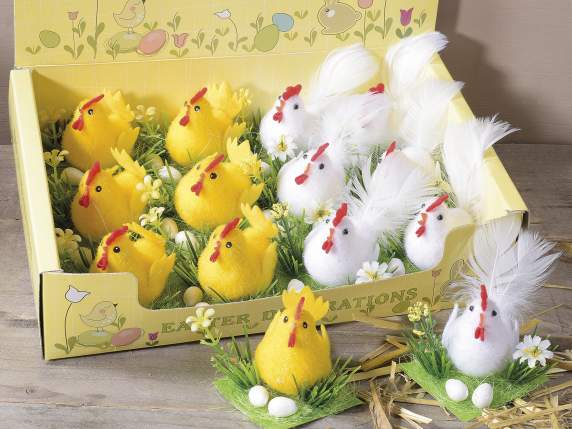 Display of 12 chickens with eggs and flowers on grass