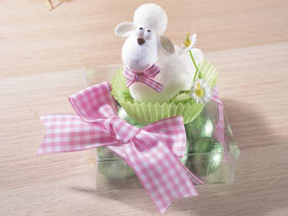 Display with 12 sheep with daisy on a clod of grass