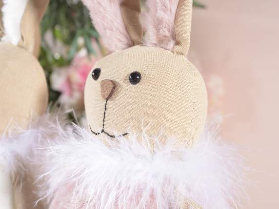Rabbit in long-legged fabric with eco-fur dress and feathers