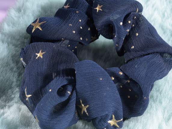 Hair elastic in fabric with golden stars decoration