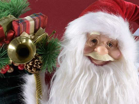 Babbo Natale seduto con bordure in morbido pelo e sacco doni