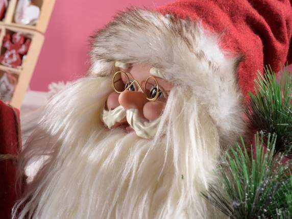 Babbo Natale con morbido cappotto in eco-fur e pacco dono