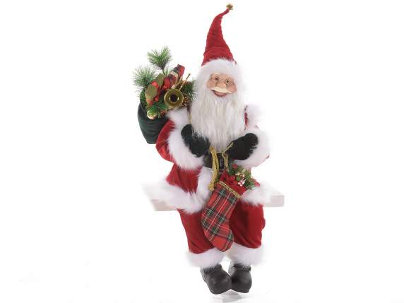 Père Noel assis avec bords en doux fourrure et sac à cadeau