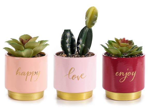 Vase en céramique avec plante artificielle et écriture dorée