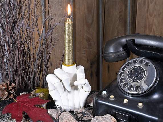 Resin candle holder in the shape of a skeleton hand