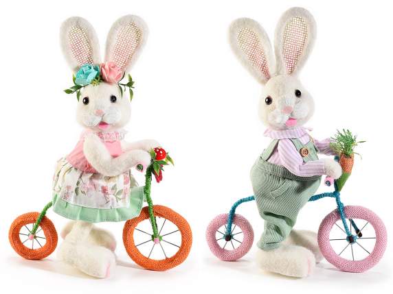 Coniglietto in morbido pelo artificiale in bicicletta