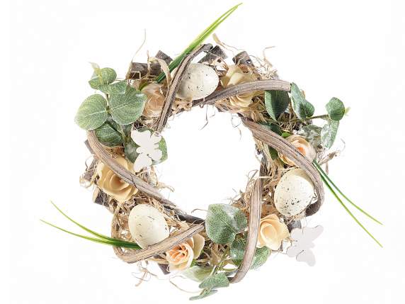 Ghirlanda in legno e paglietta con fiori e uova