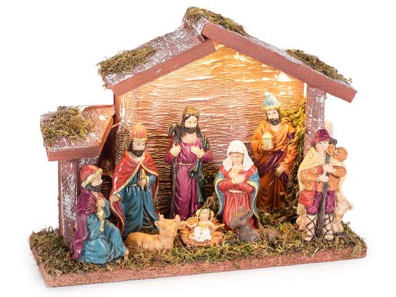 Presepe in legno con personaggi in resina, muschio, luci LED